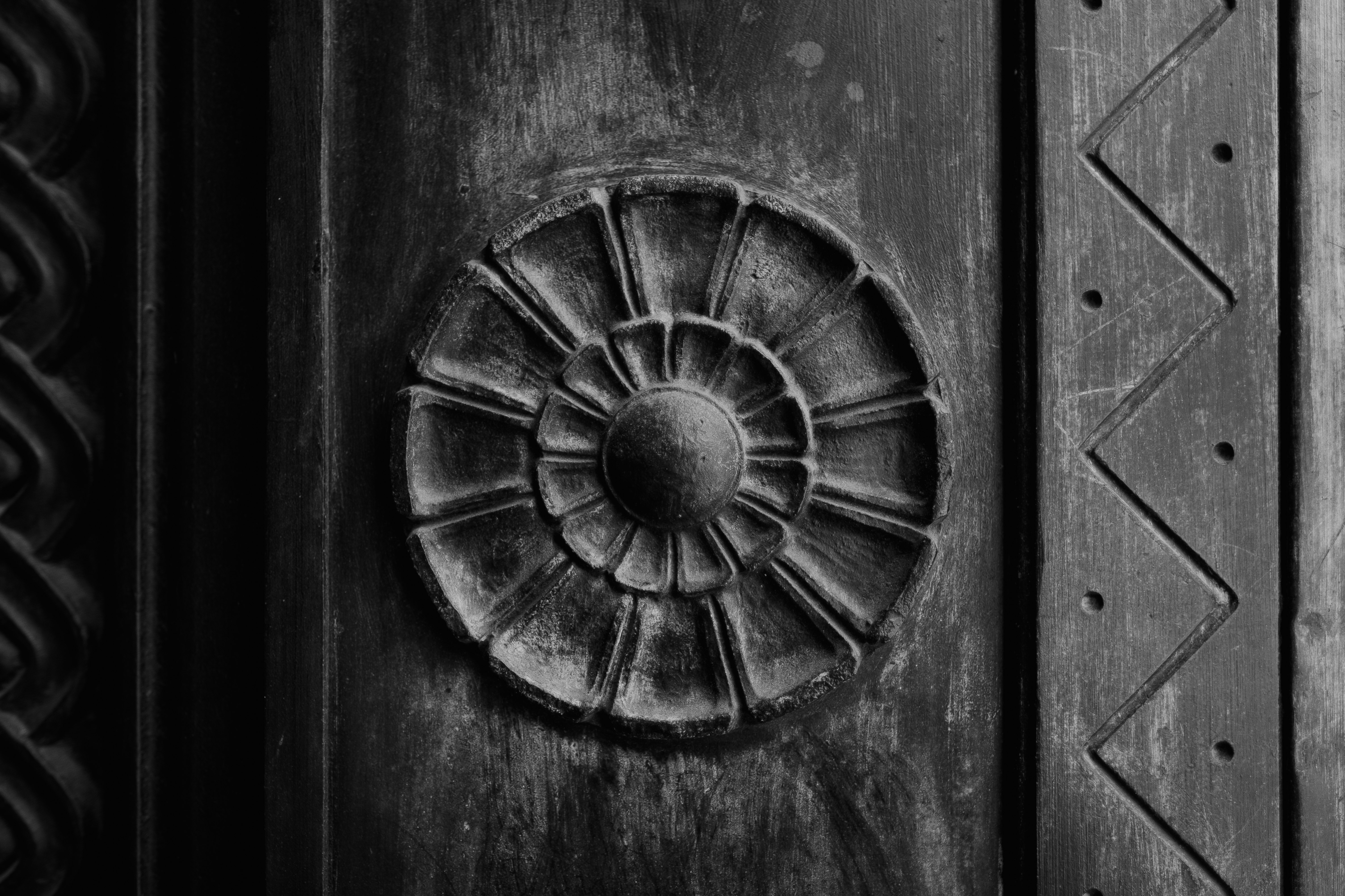 grayscale photo of wooden door